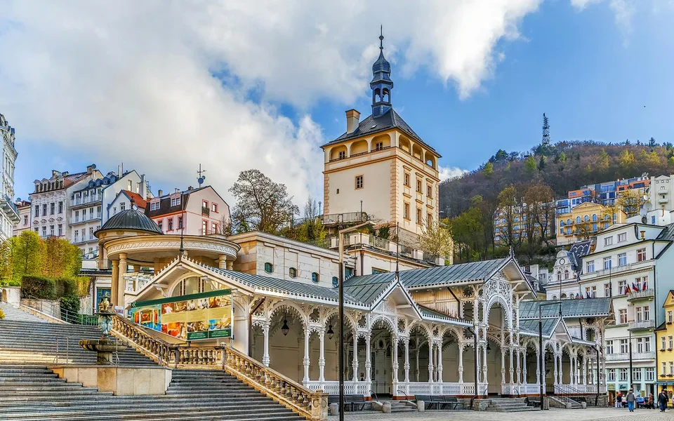 Karlovy Vary colonnade with wooded hills behind