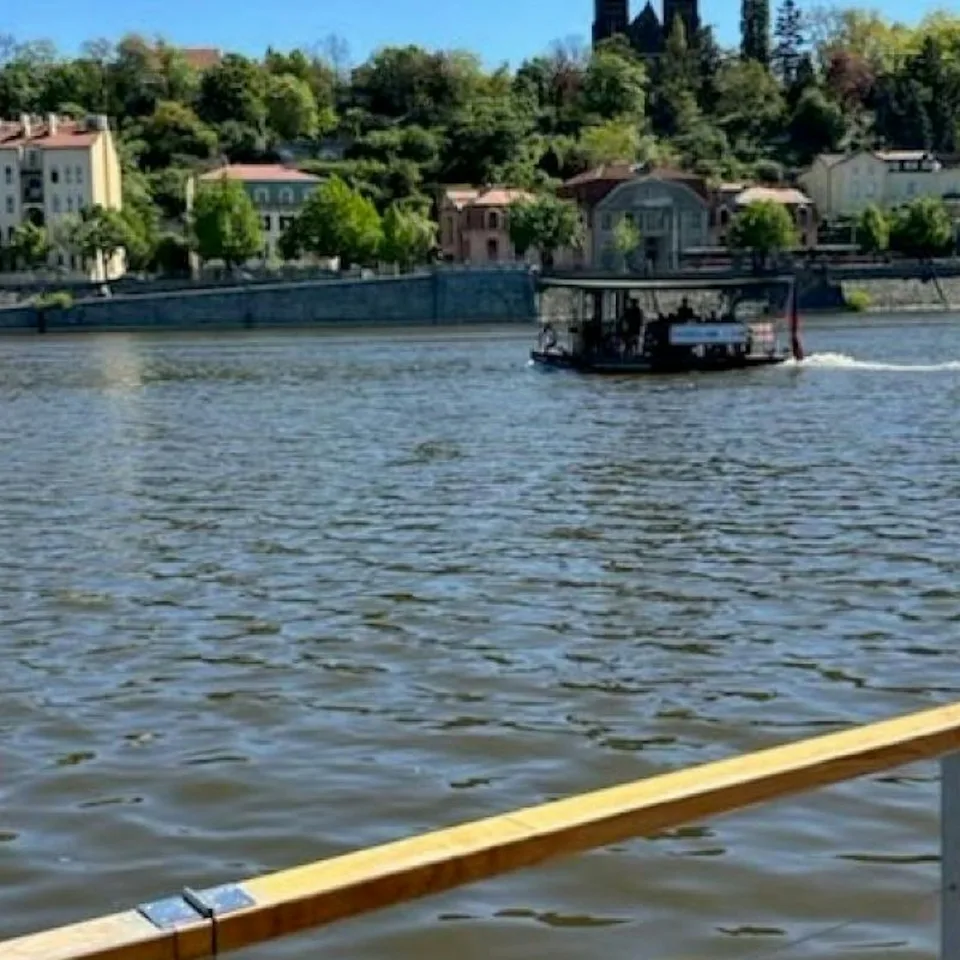 Small covered boat on the Vltava River