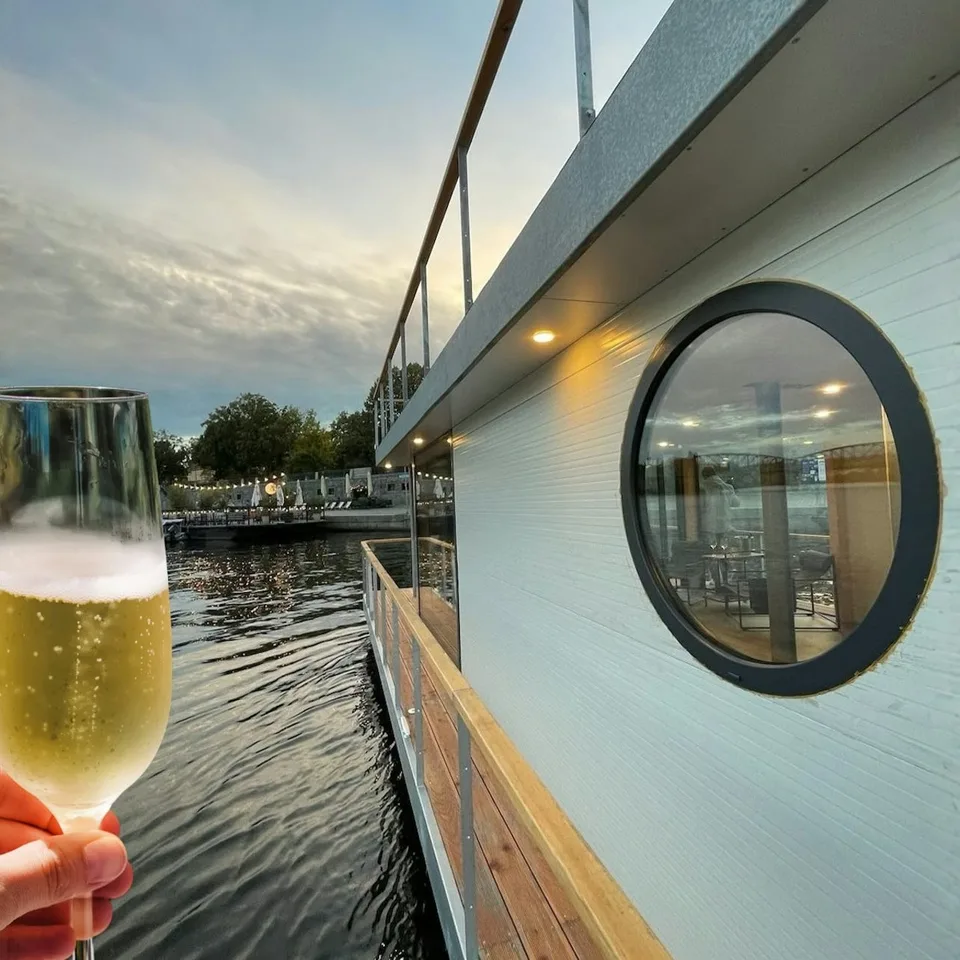 Drink beside the window of a small river boat