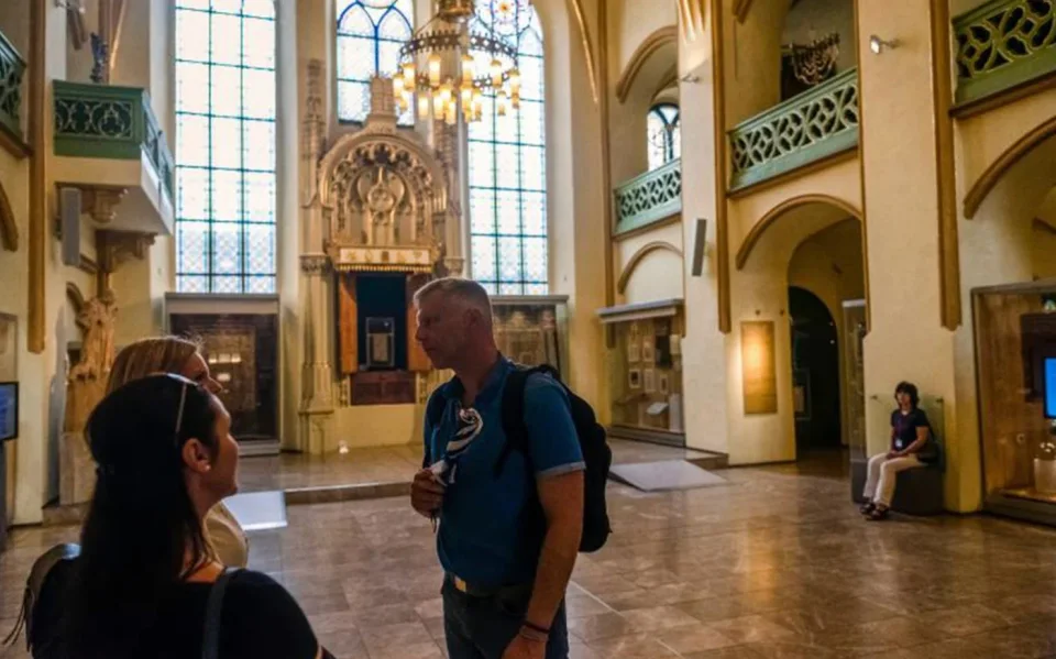 Visitors inside a synagogue in Prague’s Jewish Quarter