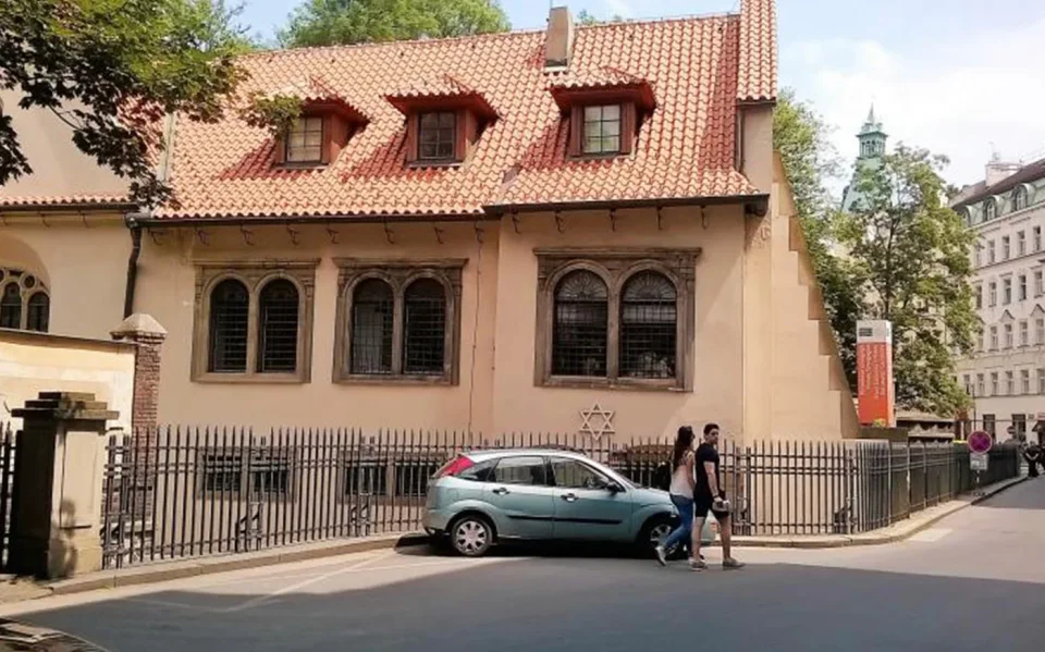 Gabled synagogue building on a street in Josefov